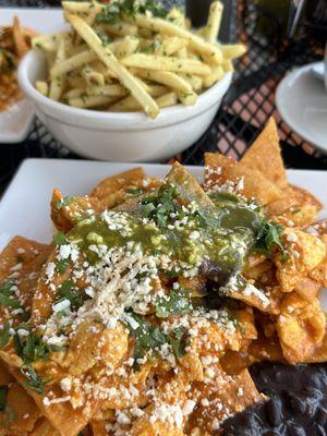 Chilaquiles with eggs. (Add more green sauce that's on the table for an even more amazing taste)