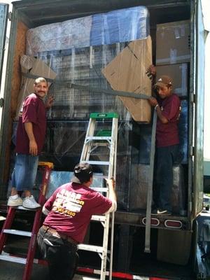 Men at Work, loading one of our 53' Tractor/Trailers for a cross-country trip