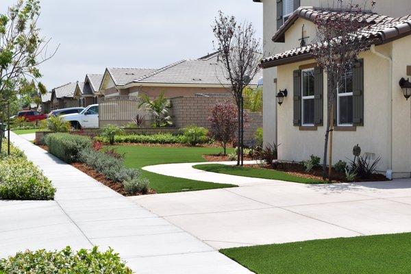 Combination turf and landscape.  This fake grass looks the best!