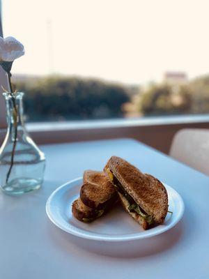 Whole wheat toast with fresh spinach, cage-free eggs, and American cheese