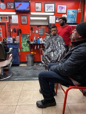 Barber cutting hair guy