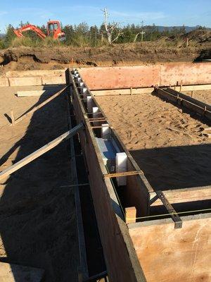 Foundation and footing ready to pour. On this project the joists actually sit inside the foundation on pockets. Very nice!