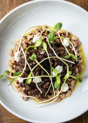 Roasted Maitake mushroom with goat cheese, black eye peas and sprouts