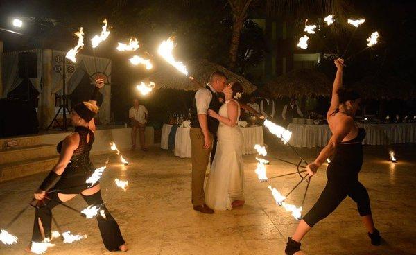 Make your destination wedding memorable and unique with special add-ons, like fire dancers!