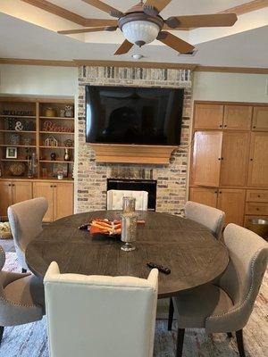 Tv mounting above fireplace on brick