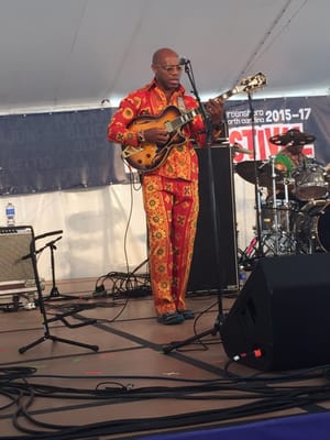 African rock guitarist - extra cool points for a FLY suit!