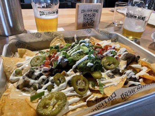 Sheet tray nachos with Jerk Chicken. Was a great choice. I usually don't like diced tomatoes. But it all went well together.