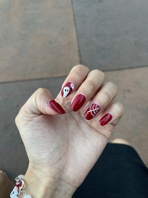 Red gel nails with Halloween designs