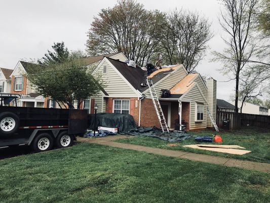 Peak Roofing Contractors replacing the roof on my townhouse.