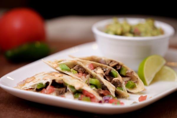 Cheesy quesadillas, served with your choice of meats and toppings.