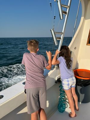 kids enjoying a cruise on the ocean front