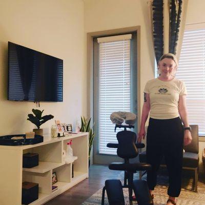 Set up for chair massage at a student apartment complex to help them de-stress after final exams.