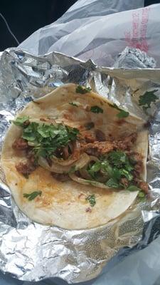 Steak taco with grilled onions and cilantro! Incredible.