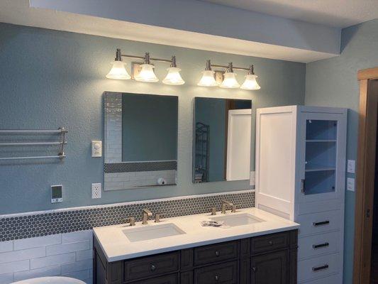 Vanity with penny round tiles as backsplash.