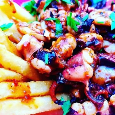 Jerk Octopus paired with fries.