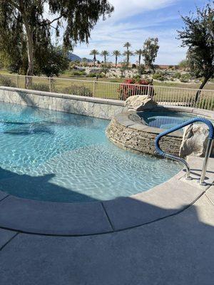 Spa and new step in pool and railing.