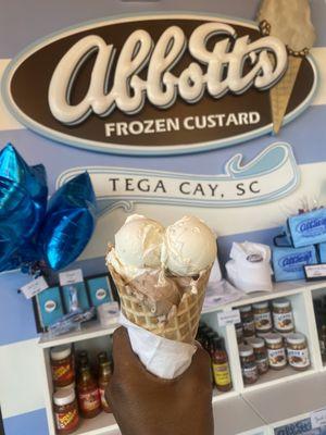 Vanilla and chocolate custard in a waffle cone