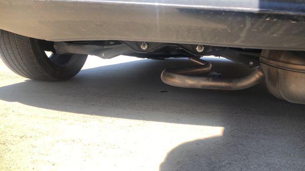 View of hanging muffler before car arrived at shop