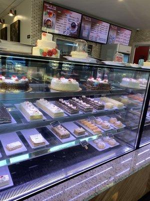 Front of the counter with cakes displays