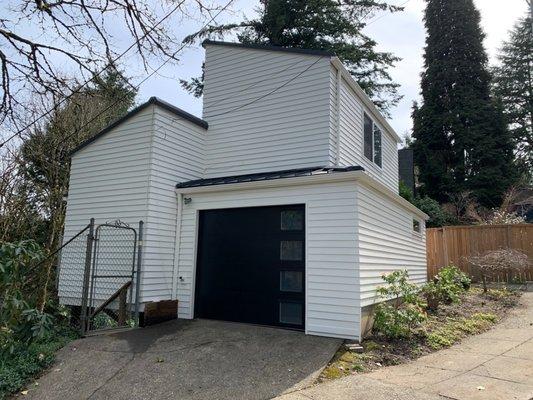 "After" photo of the garage side exterior.