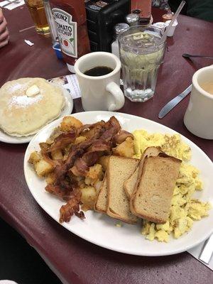 Undercooked pancakes, untoasted toast, and overcooked eggs