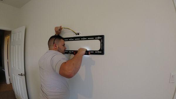 Our Experts installing a TV Bracket