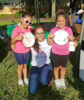 Founder, Debra Tendrich, With some children doing a nutritional art project.