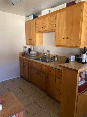 Although galley kitchen enough space for many to cook at once. Newer apartments have updated cabinets.