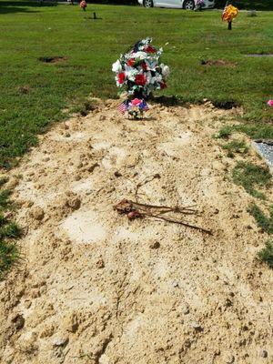 Notice how they moved the headstone to the side of the way the casket was placed and not to mention the headstone is cracked in half