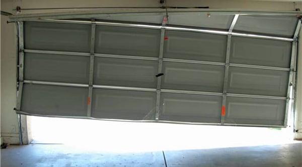 Rogers Overhead Door repair broken garage door cable and off track doors.