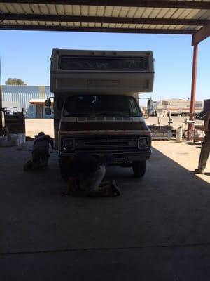 The guys getting our RV's tires replaced for burning man.