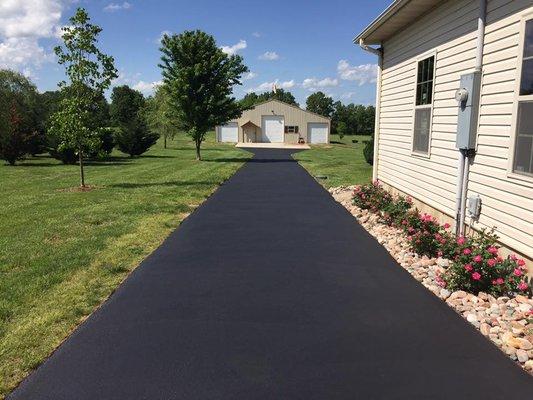 Driveway crack filled and sealcoated by Ozark Asphalt Coating