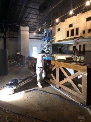 Staining and varnishing all the wood inside the new whiskey River in Richmond Tx.