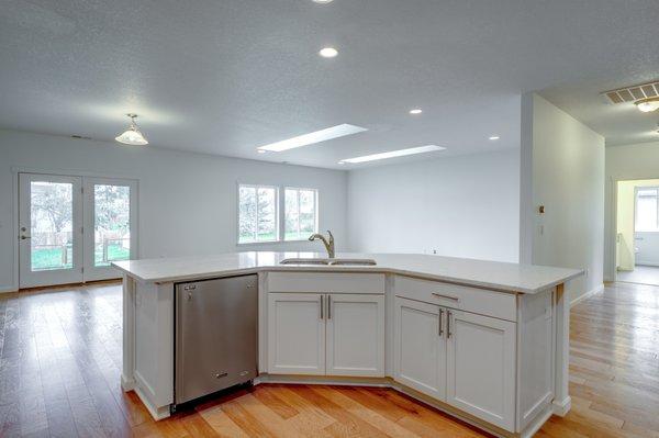 An open floor concept with the kitchen, dining and living room.