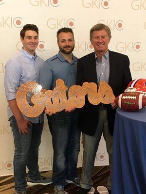 2 Members of Everlast Epoxy, presenting former, University of Florida, Head Coach, Steve Spurrier, with a custom, metallic epoxy cutout.