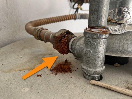 Water heater valve buildup form small leak or self water condensation.