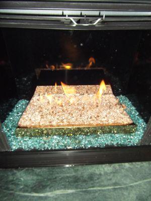 Closeup of  new reflective glass fireplace