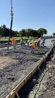 Pouring concrete paving with pump