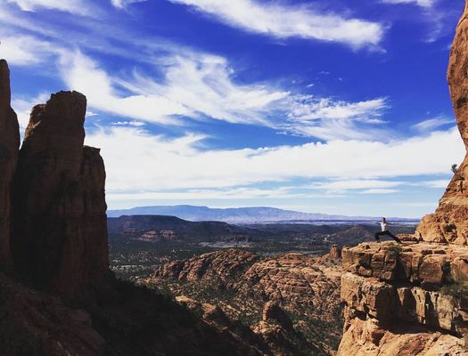 Twisted Sister Yoga NJ empowers men and women in a Warrior 2 yoga pose in Arizona.