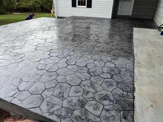 stamped patio with black powder that customer wanted, we can use a variety of colors