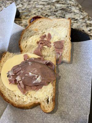 It looks like it's only one slice of roast beef with some cheese and mayonnaise. A little stingy on the roast beef really for seven bucks.