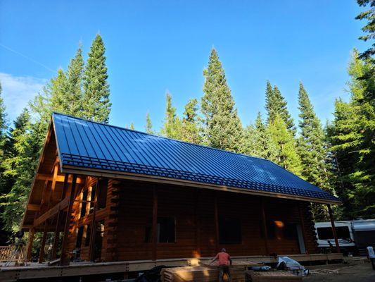 Custom standing seam metal roof with snow guards on a residential project in eastern Oregon.