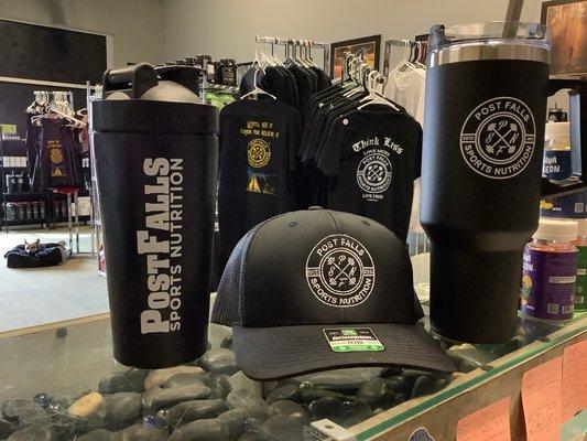 Metal shakers, hats, and travel mugs.