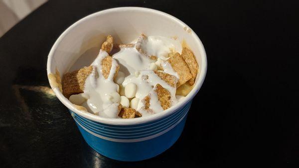 Cake batter cookie dough with marshmallow topping, white chocolate chips, and cinnamon toast crunch