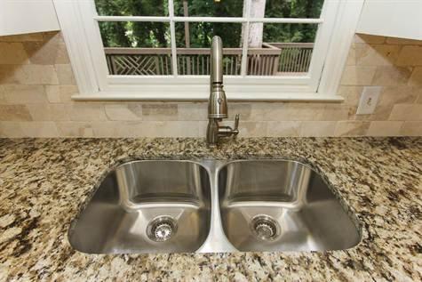 Stainless steel sink and brushed nickel faucet.