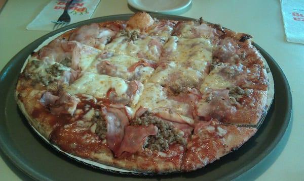 14 inch pizza with sausage, ham, and BBQ sauce - my face!  Deliciousness.