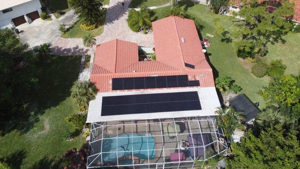 Happy homeowner install in Fort Meyers onto a tile and flat roof.