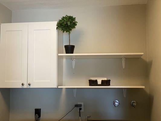 Shelves and a cabinet .