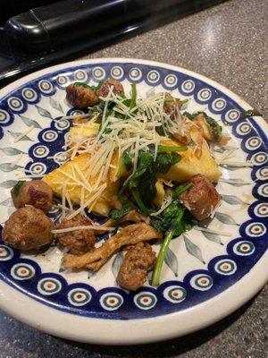 Italian sausage with spinach and wild mushrooms over polenta