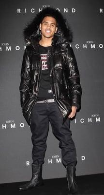 Chris Brown wearing a John Richmond fur collar jacket. John Richmond's designs are carried at TRAFFIC Los Angeles